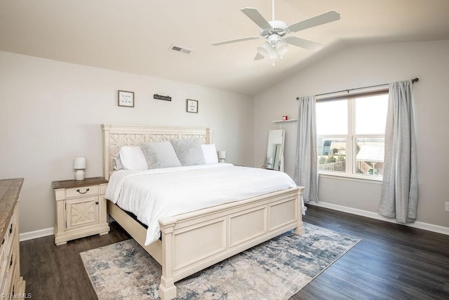 bedroom featuring dark wood-style floors, visible vents, baseboards, and vaulted ceiling