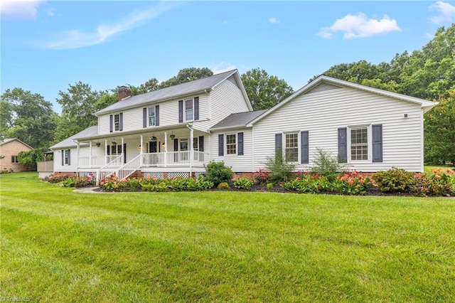 2305 Hunters Ridge Dr, Pleasant Garden, NC 27313 - view of front of house with covered porch, a chimney, a front yard, and crawl space