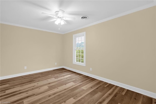 2305 Hunters Ridge Dr, Pleasant Garden, NC 27313 - spare room featuring baseboards, ornamental molding, wood finished floors, and ceiling fan