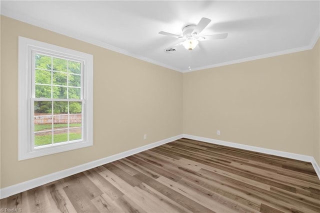 2305 Hunters Ridge Dr, Pleasant Garden, NC 27313 - empty room with baseboards, ornamental molding, wood finished floors, and ceiling fan