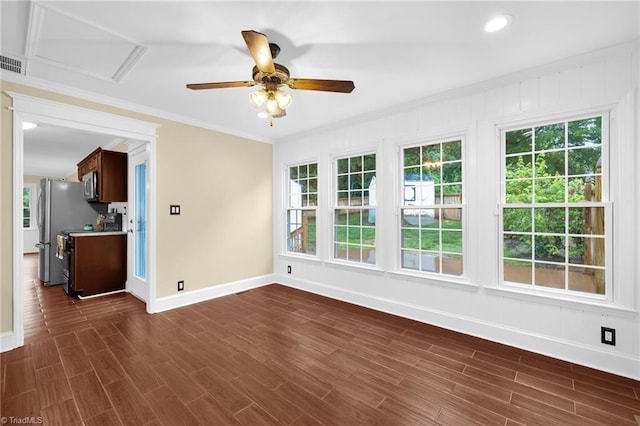 2305 Hunters Ridge Dr, Pleasant Garden, NC 27313 - spare room with baseboards, ceiling fan, ornamental molding, plenty of natural light, and dark wood-style flooring