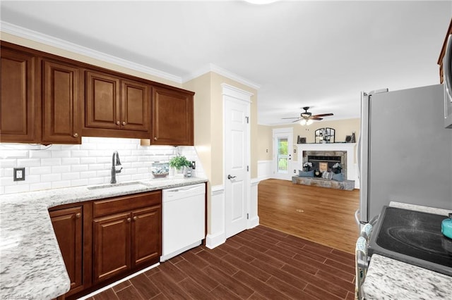 2305 Hunters Ridge Dr, Pleasant Garden, NC 27313 - kitchen with stainless steel appliances, a sink, a ceiling fan, ornamental molding, and dark wood finished floors