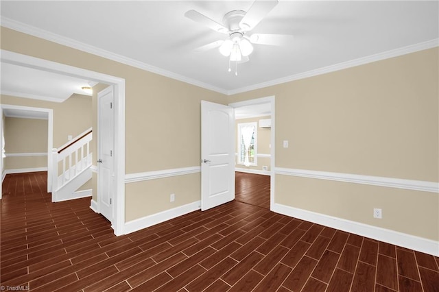 2305 Hunters Ridge Dr, Pleasant Garden, NC 27313 - empty room featuring baseboards, ceiling fan, crown molding, dark wood finished floors, and stairs