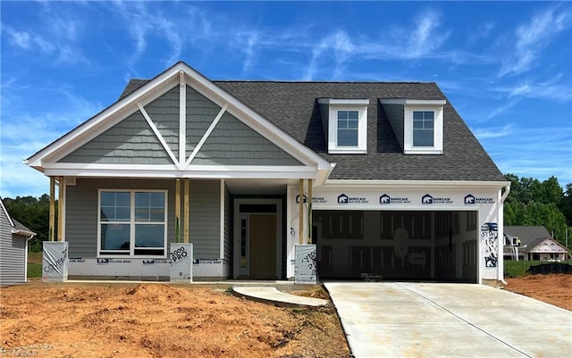 649 Ellabell Dr, Winston-Salem, NC 27127 - view of front facade featuring covered porch, driveway, and a shingled roof