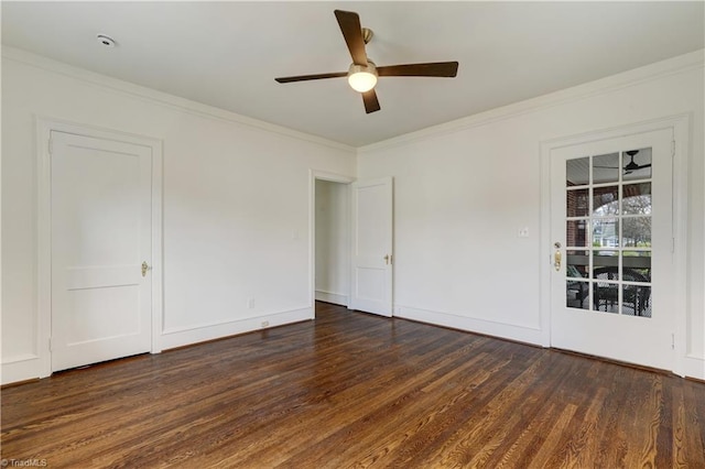 unfurnished room featuring a ceiling fan, crown molding, wood finished floors, and baseboards