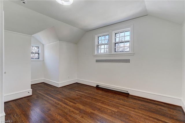 bonus room featuring lofted ceiling, wood finished floors, baseboards, and visible vents