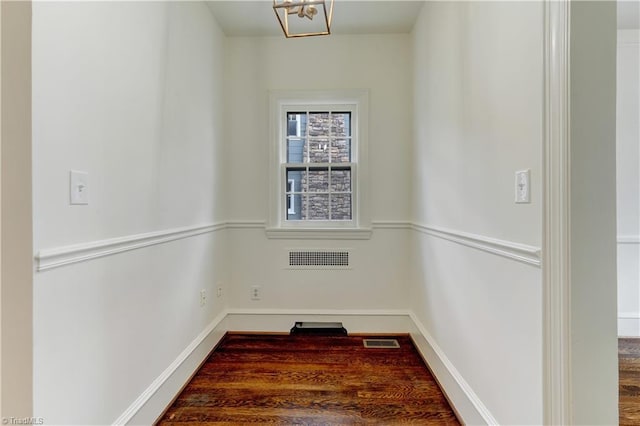 spare room featuring visible vents and baseboards