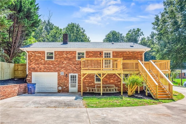 view of front of property with a garage and a deck