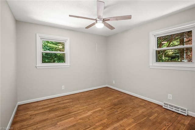 spare room featuring ceiling fan and wood-type flooring