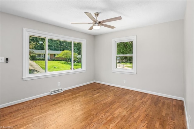 unfurnished room featuring ceiling fan and wood-type flooring