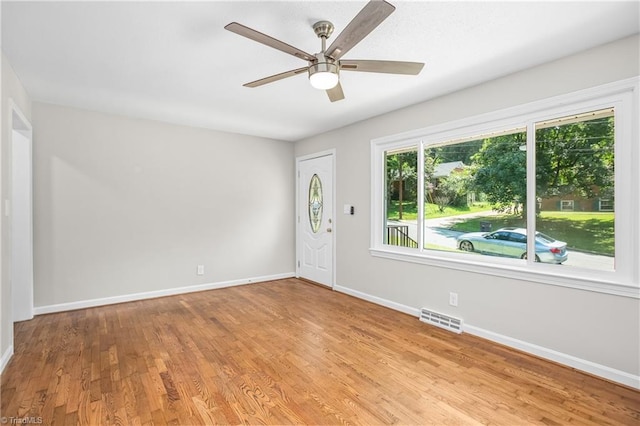 entryway with light hardwood / wood-style flooring and ceiling fan