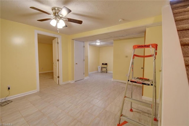 basement featuring ceiling fan