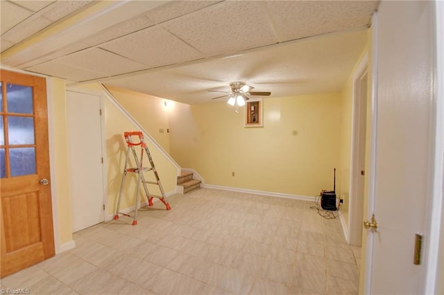 playroom featuring a drop ceiling and ceiling fan