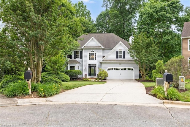 traditional-style house featuring driveway and a garage