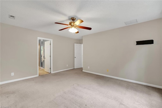 unfurnished bedroom featuring carpet flooring, baseboards, a ceiling fan, and ensuite bathroom