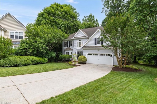 view of front of property with a garage, concrete driveway, and a front yard