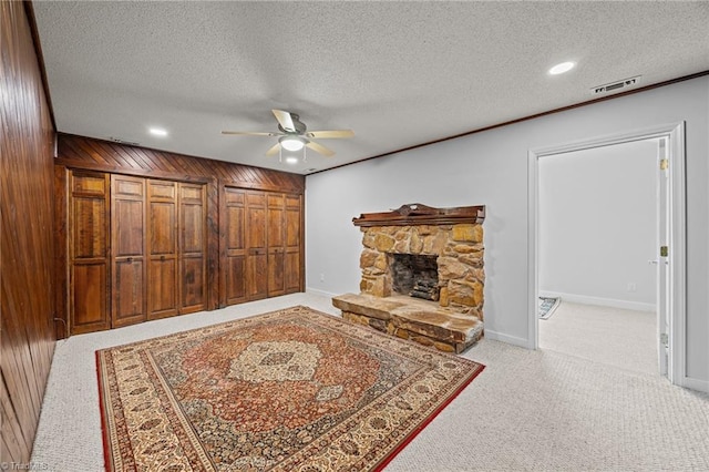 1902 Meadow Lake Ln, Sophia, NC 27350 - carpeted living area with a ceiling fan, a textured ceiling, recessed lighting, a stone fireplace, and baseboards