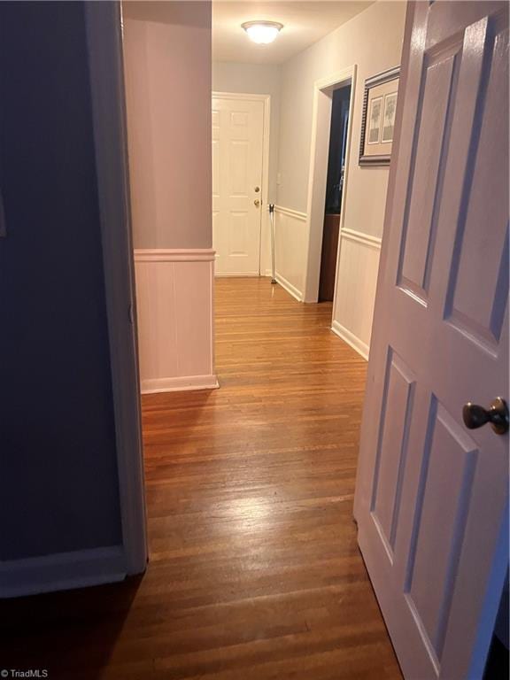 hall with dark hardwood / wood-style floors