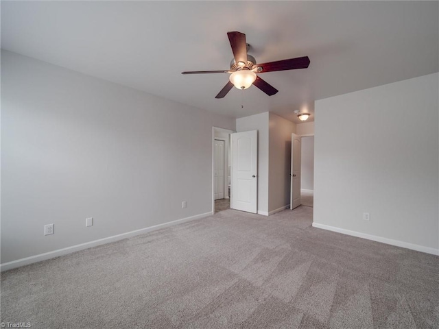 unfurnished bedroom with ceiling fan and light carpet