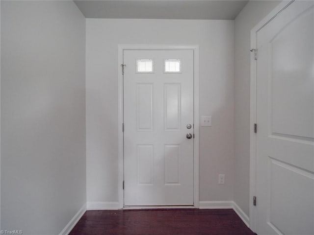 foyer with dark hardwood / wood-style floors