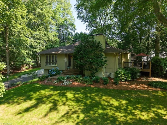 5017 Timbrook Ln, Winston-Salem, NC 27103 - view of front of home with a front yard, a deck, and a garage