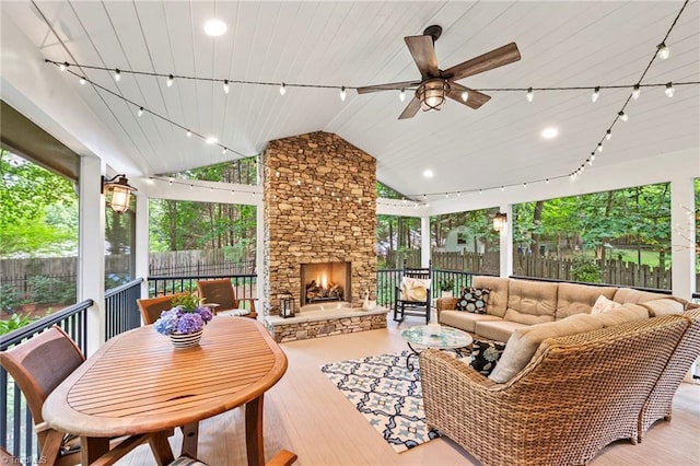 5017 Timbrook Ln, Winston-Salem, NC 27103 - fenced backyard with an outdoor living space with a fireplace and a ceiling fan