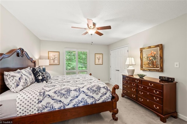 5017 Timbrook Ln, Winston-Salem, NC 27103 - bedroom featuring carpet floors, a ceiling fan, baseboards, and a closet