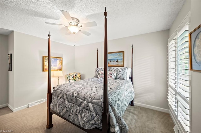 5017 Timbrook Ln, Winston-Salem, NC 27103 - bedroom featuring carpet flooring, baseboards, a ceiling fan, and a textured ceiling