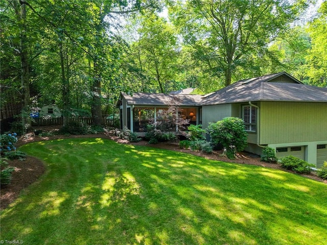 5017 Timbrook Ln, Winston-Salem, NC 27103 - view of yard featuring a sunroom and a garage