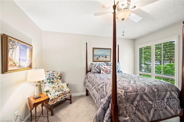 5017 Timbrook Ln, Winston-Salem, NC 27103 - carpeted bedroom featuring a textured ceiling, baseboards, and a ceiling fan