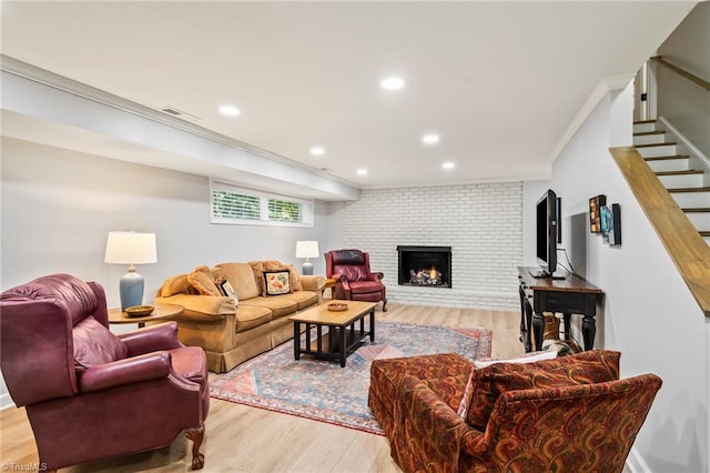 5017 Timbrook Ln, Winston-Salem, NC 27103 - living room featuring light wood-type flooring, a brick fireplace, ornamental molding, stairs, and recessed lighting