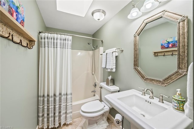 5017 Timbrook Ln, Winston-Salem, NC 27103 - bathroom with toilet, shower / bath combo with shower curtain, a sink, a skylight, and tile patterned flooring