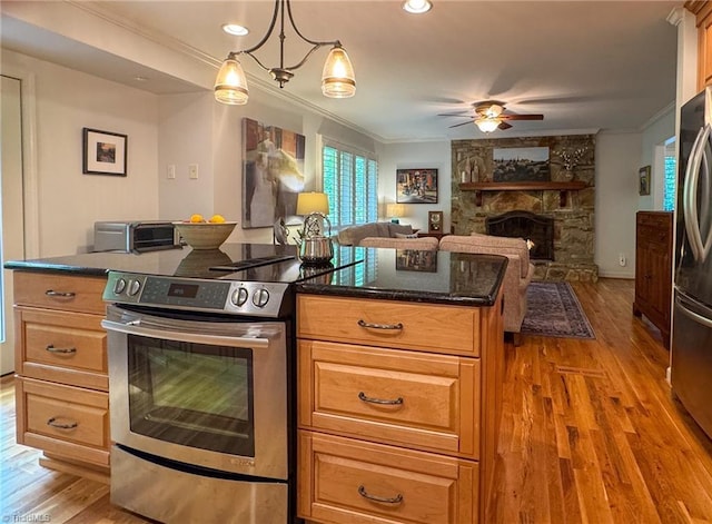 5017 Timbrook Ln, Winston-Salem, NC 27103 - kitchen with appliances with stainless steel finishes, ornamental molding, wood finished floors, a ceiling fan, and open floor plan