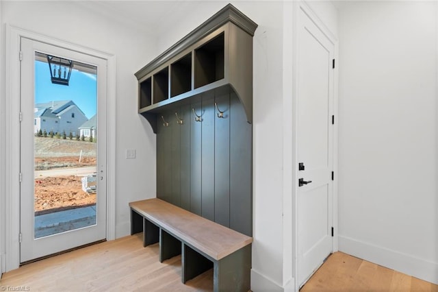 mudroom with light hardwood / wood-style flooring