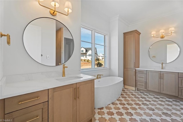 bathroom featuring ornamental molding, a tub to relax in, and vanity