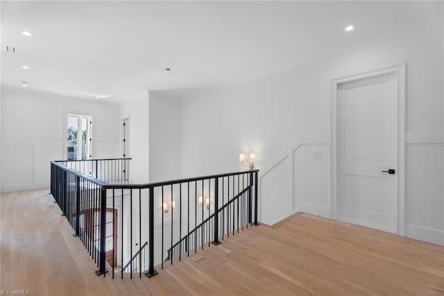 hallway with light hardwood / wood-style flooring