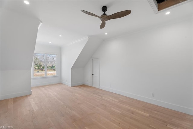 bonus room with light hardwood / wood-style floors and ceiling fan