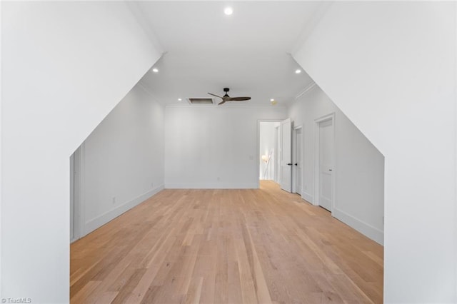 additional living space featuring ceiling fan and light hardwood / wood-style flooring