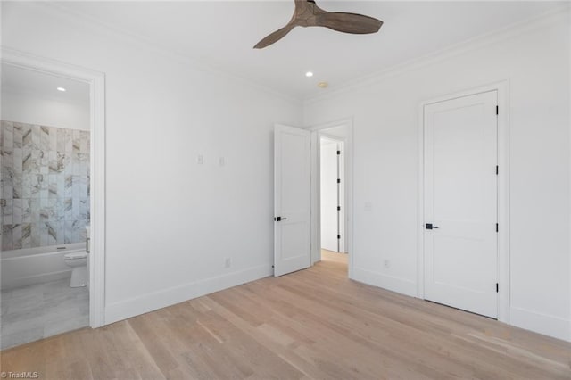 unfurnished bedroom with light wood-type flooring, connected bathroom, ornamental molding, and ceiling fan