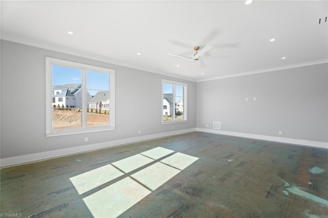 spare room with ornamental molding and ceiling fan