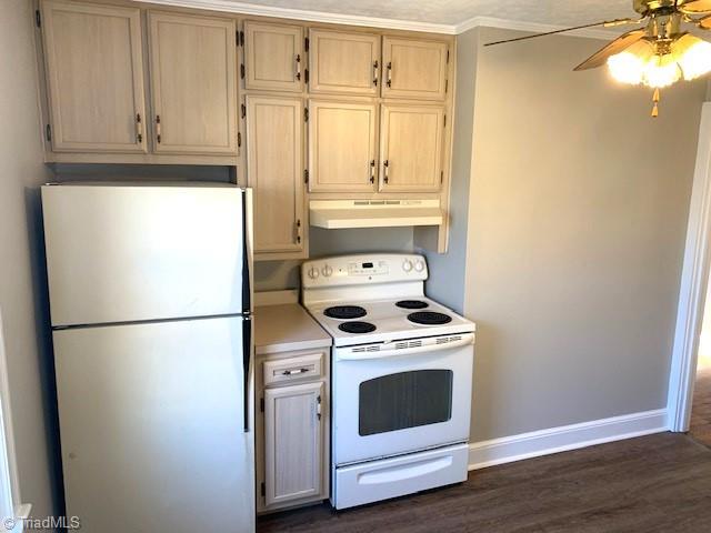 kitchen featuring white appliances, crown molding, ceiling fan, light brown cabinetry, and dark hardwood / wood-style flooring