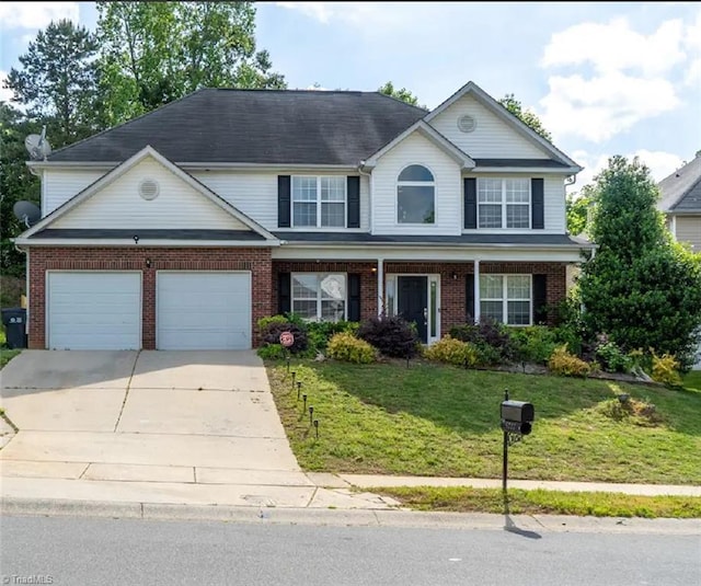 5227 Eagle Creek Dr, Charlotte, NC 28269 - view of front facade featuring brick siding, an attached garage, driveway, and a front yard