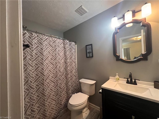 5227 Eagle Creek Dr, Charlotte, NC 28269 - bathroom with toilet, vanity, a textured ceiling, and a shower with curtain
