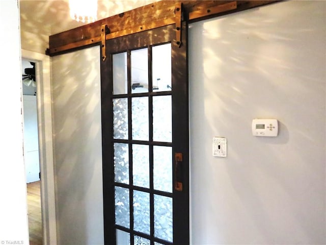 interior details featuring a barn door