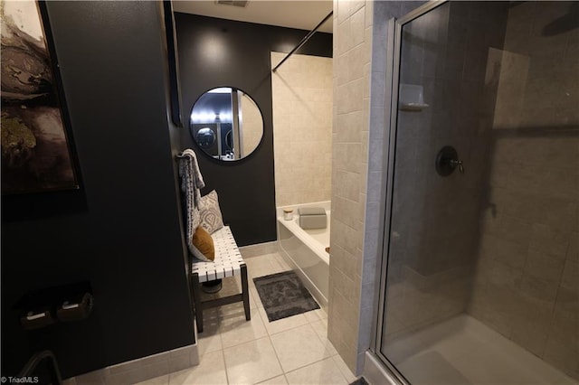 bathroom with tile patterned flooring and independent shower and bath