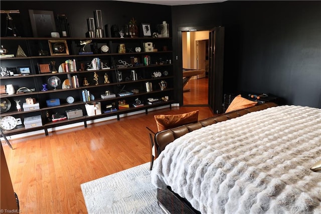 bedroom with wood-type flooring