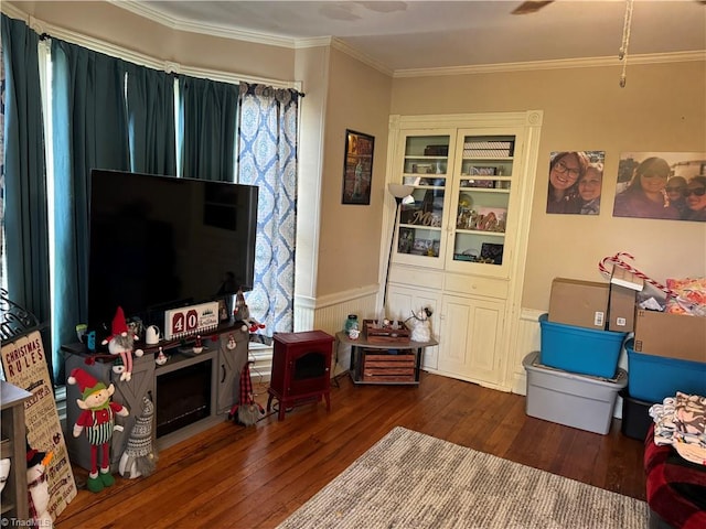 living room with ornamental molding and dark wood-type flooring