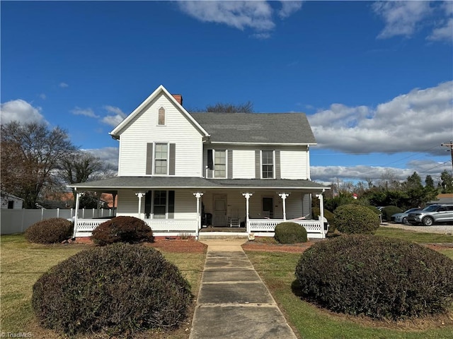 farmhouse with a front yard