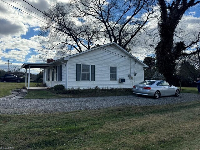 view of home's exterior with a lawn