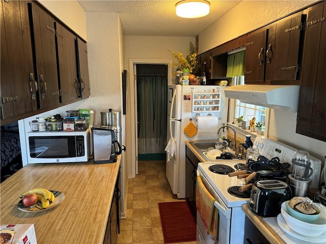 kitchen featuring ventilation hood, sink, white electric stove, a textured ceiling, and dark brown cabinetry